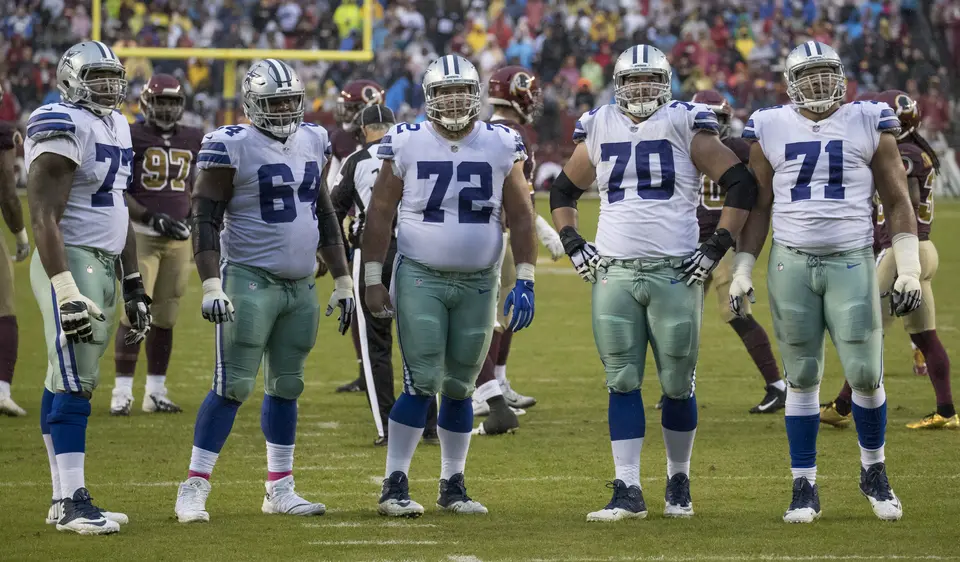 Dallas Cowboys offensive linemen in a game against Washington