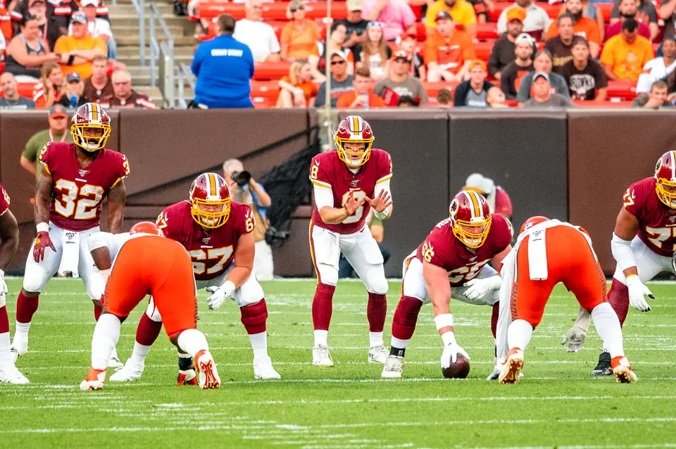 Case Keenum under center before a snap in an NFL game against the Cleveland Browns